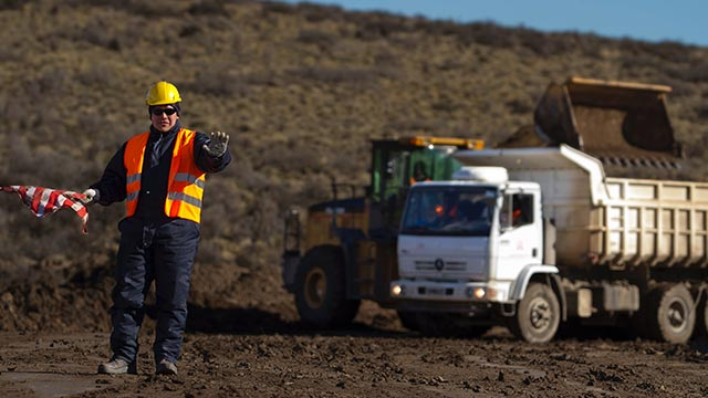 Mining worker noting to stop