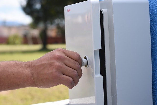 Man looking to change out box.