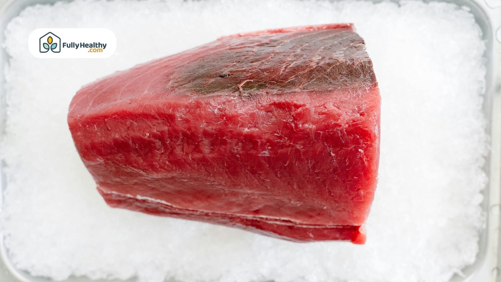 Raw tuna block placed on crushed ice for freshness preservation
