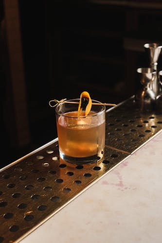 The simplicity of an old fashioned cocktail, garnish wrapped through the pick