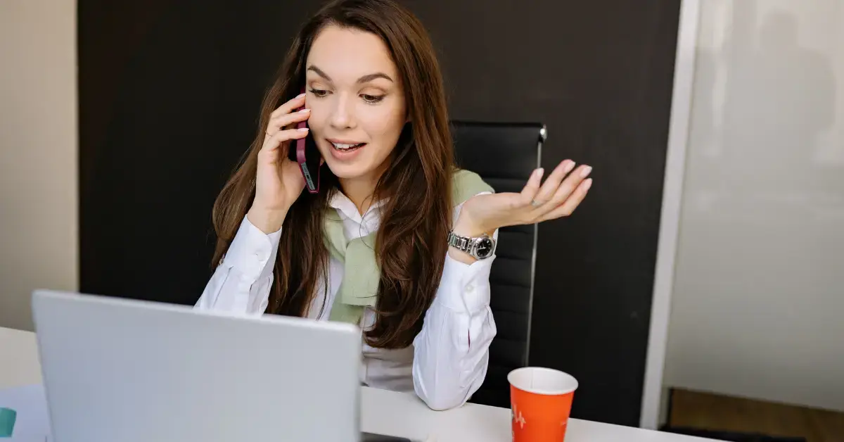 Woman reviewing an IRS lien notice and property records while considering whether to hire a tax lien attorney.