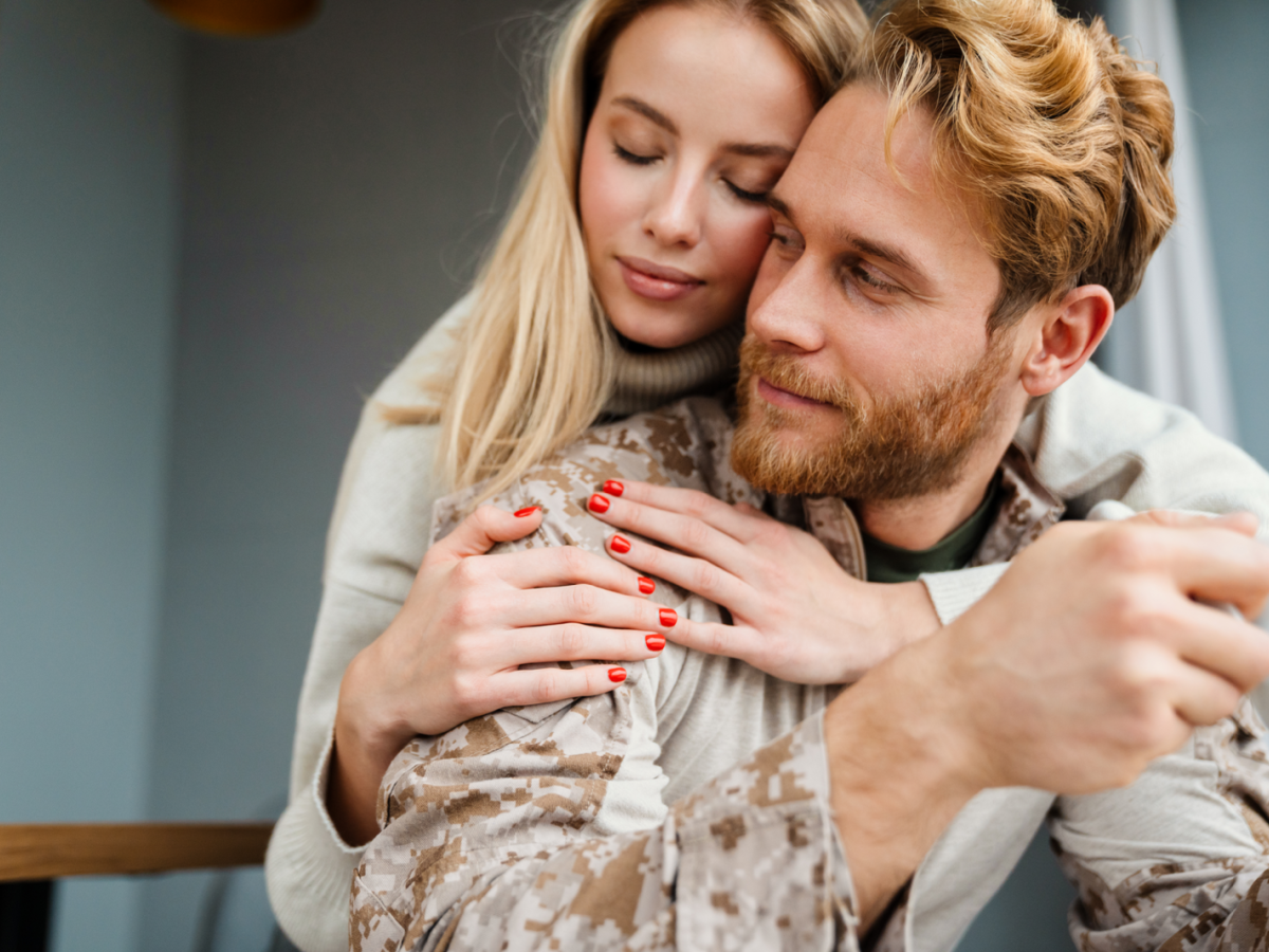 Reconciled couple embracing in New York after affair recovery therapy at Loving at Your Best Marriage and Couples Counseling.