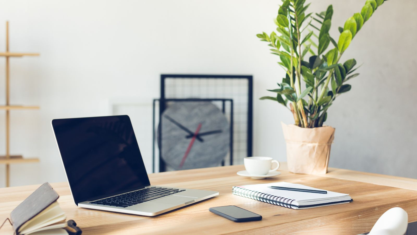 desk workspace with personal planner and computer