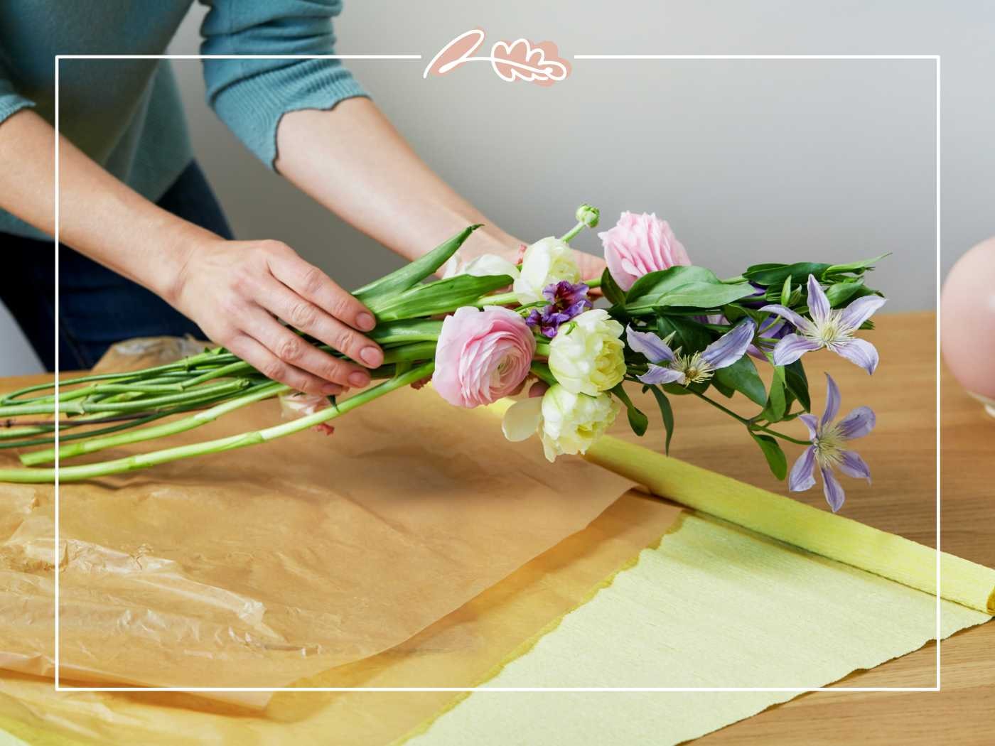 Arranging a delicate bouquet of flowers by Fabulous Flowers and Gifts