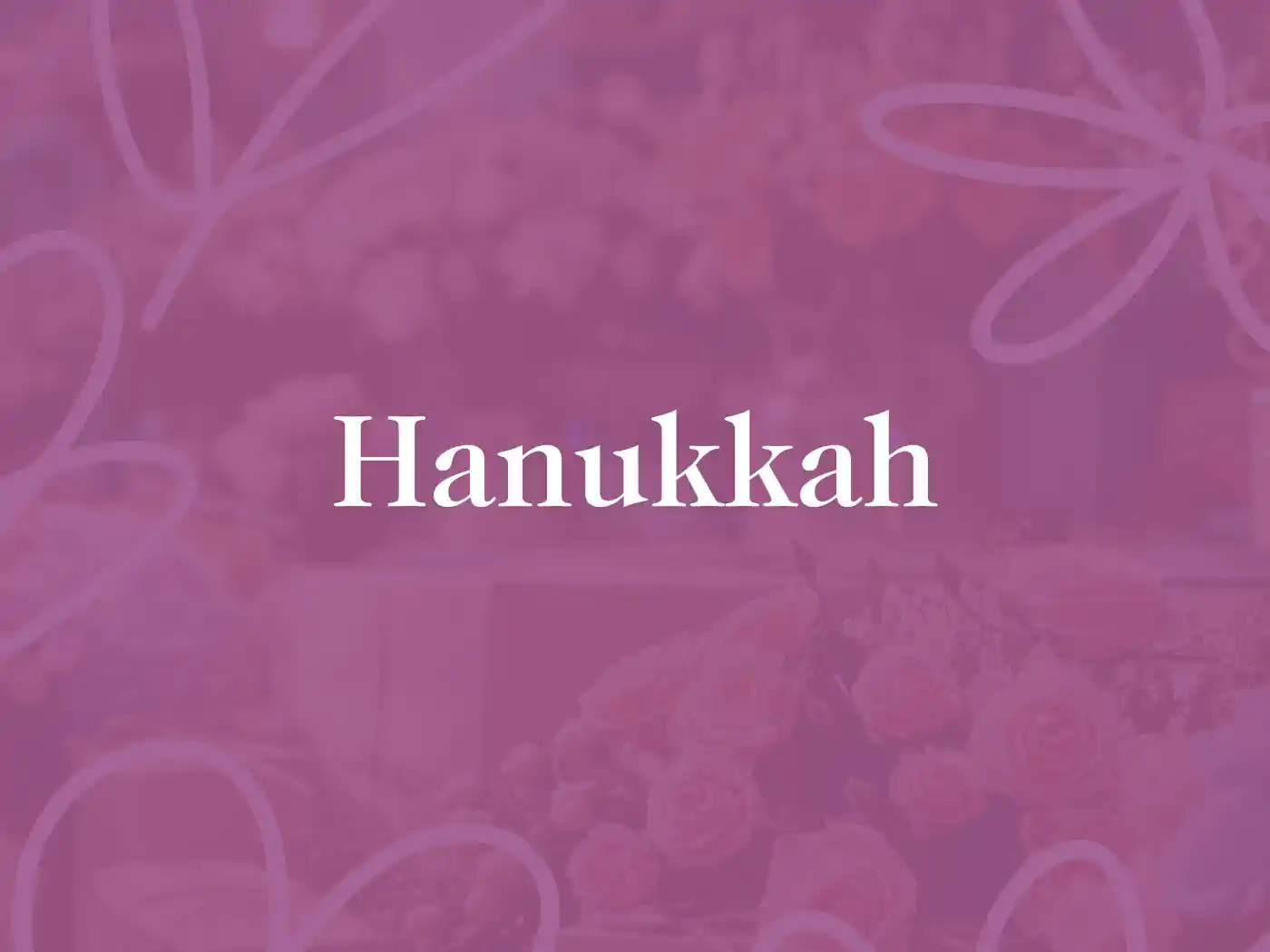 A vibrant purple background with "Hanukkah" written in elegant white text. Fabulous Flowers and Gifts - Hanukkah Collection.