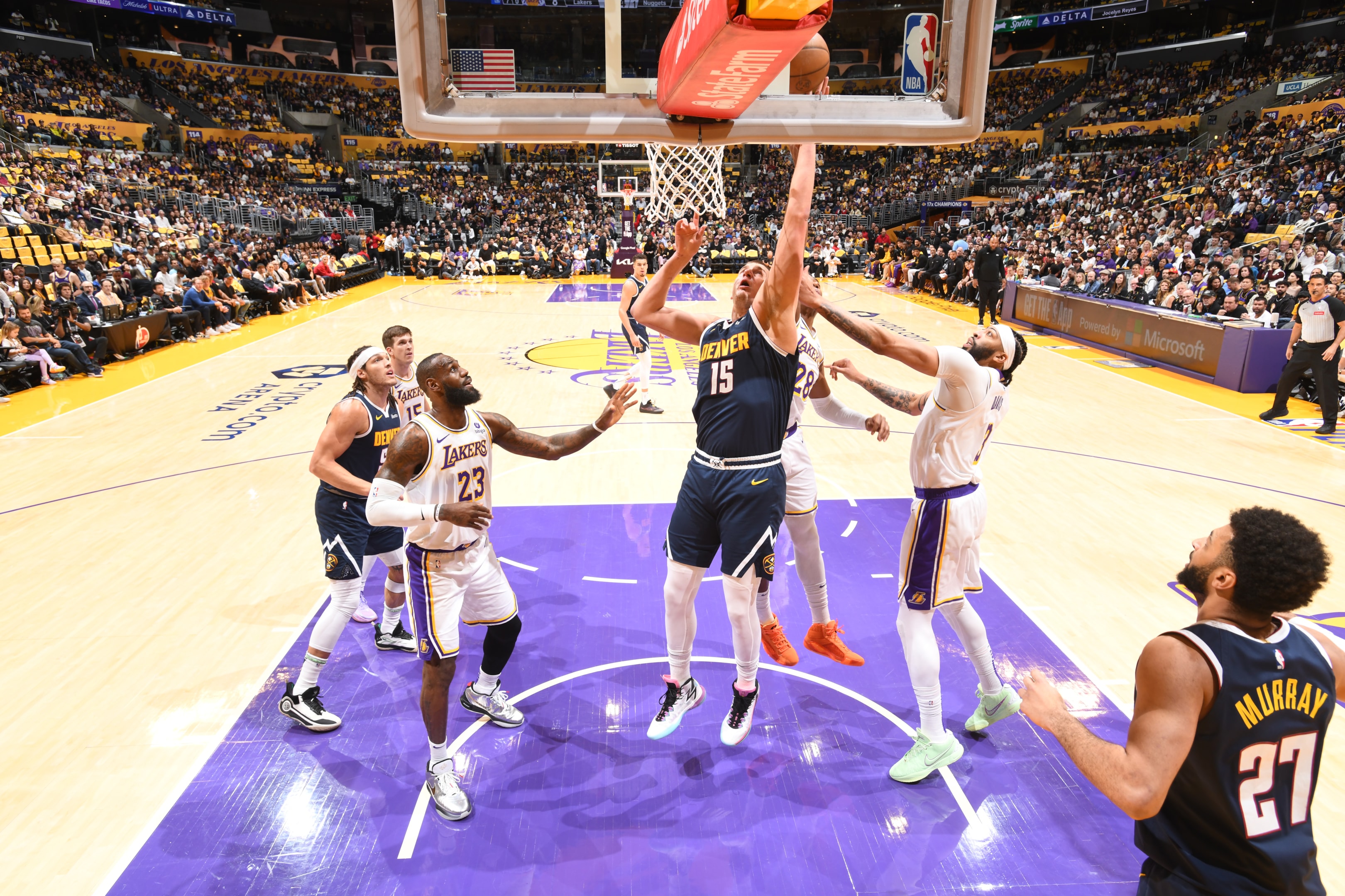 2024 MVP Nikola Jokic of the Denver Nuggets drives to the basket against Lebron James of the Los Angeles Lakers during the 2024 NBA Playoffs