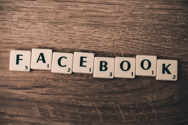 Social media: Facebook spelled out with scrabble pieces.