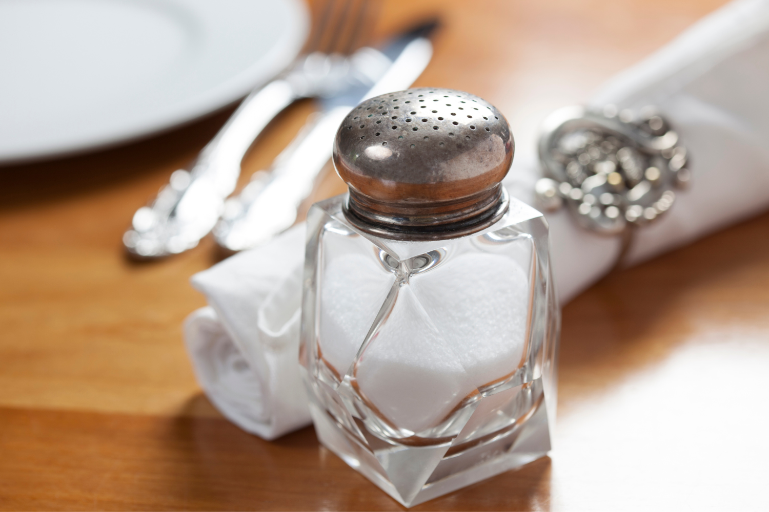 Salt shaker on a dining table.