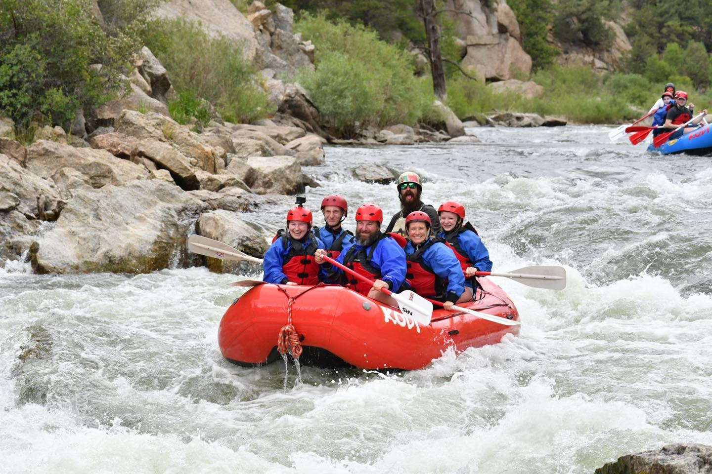 A group rafting through Clear Creek Canyon