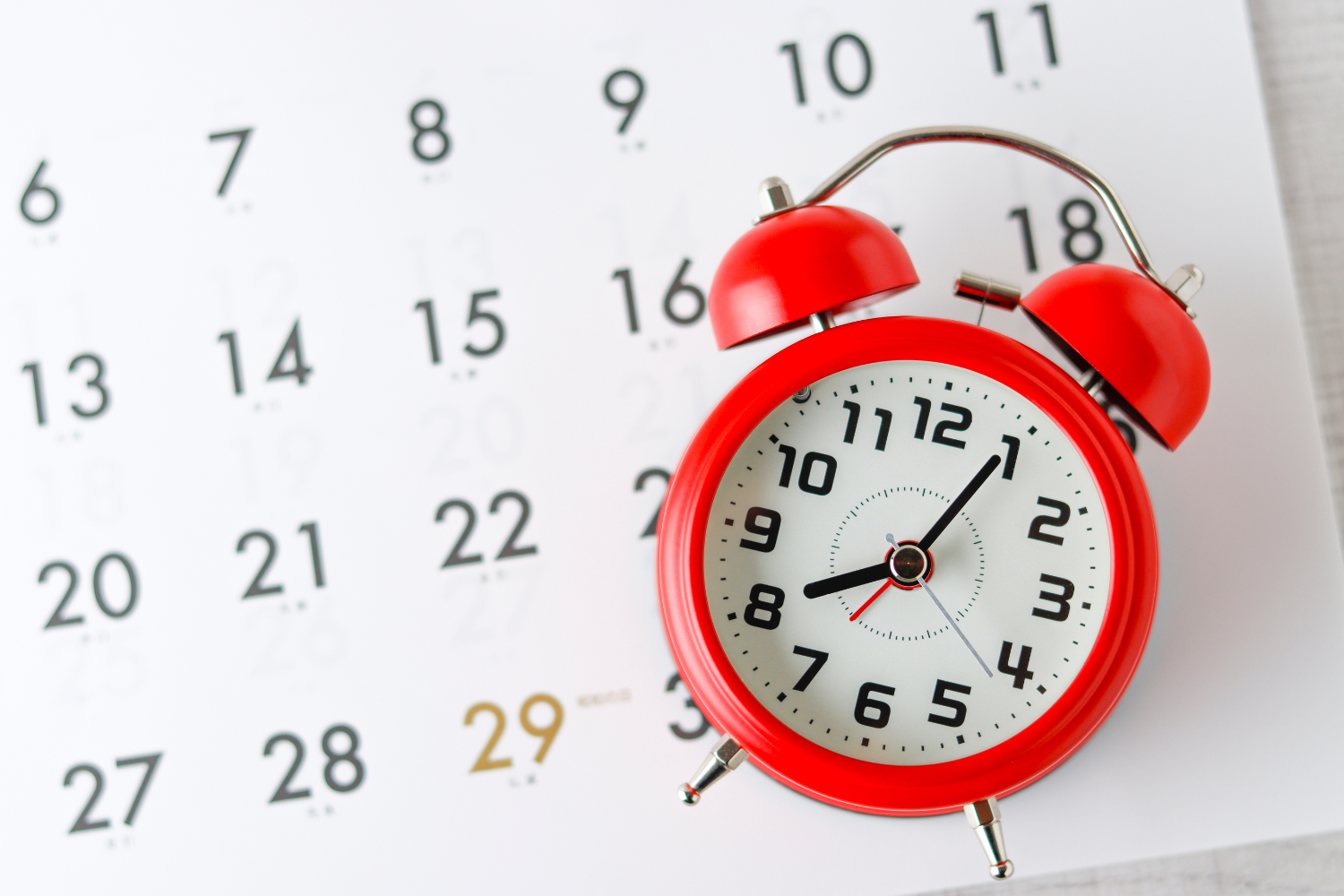 A clock and a calendar, representing efficient decision-making.