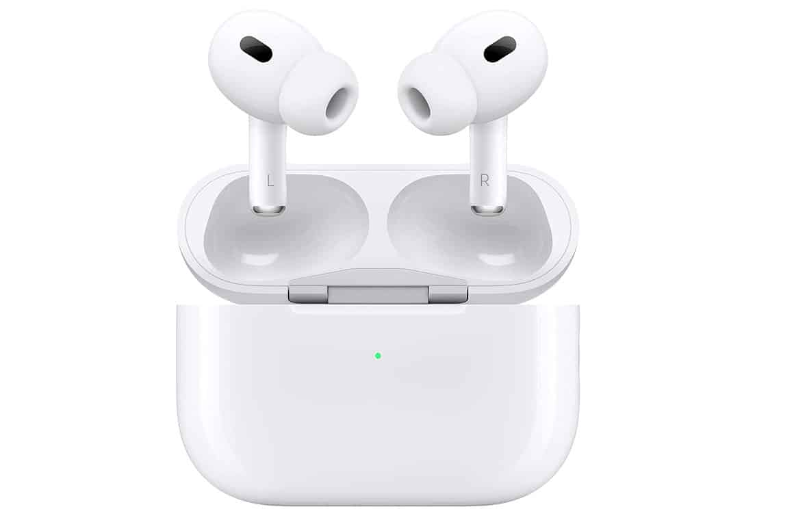 White Apple AirPods Pro wireless earbuds nestled inside their charging case, with the lid open and the earbuds visible. The case has a glossy white finish and a LED light on the front indicating the charging status of the earbuds.