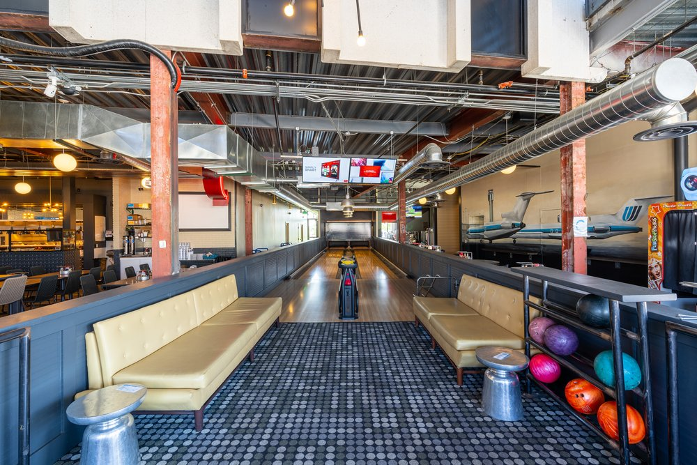 Bowling lanes at Flytco Tower, an attraction in Denver's Central Park neighborhood 