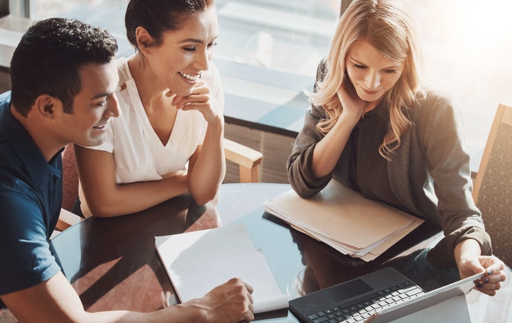 Group of accountants discussing employers national insurance contributions