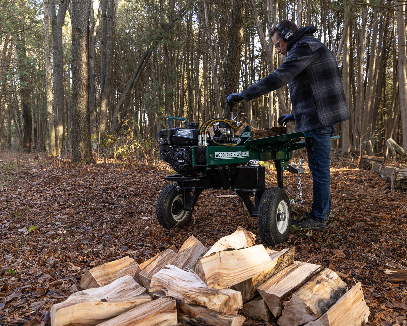 A Woodland Mills LS218 Log Splitter in a forest.