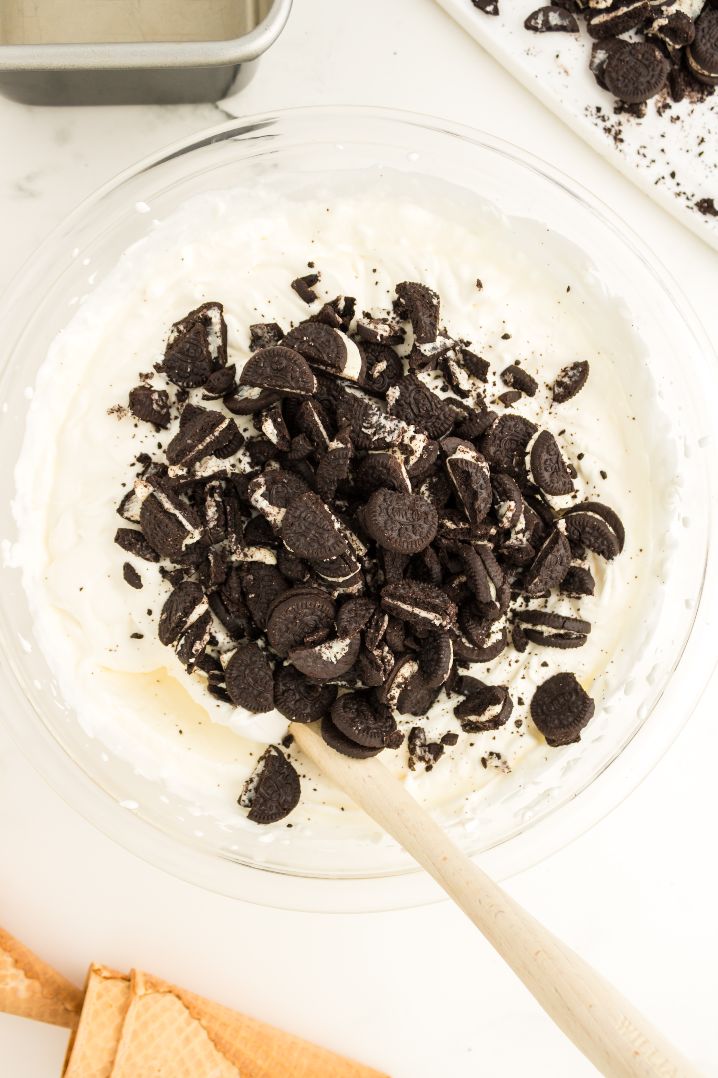 Oreo cookies in ice cream mixture in bowl