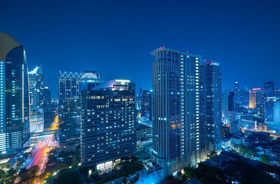 Skyscrapers lit up at night.
