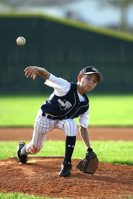 a young righthanded pitcher attempting to throw a slider to right handed hitters