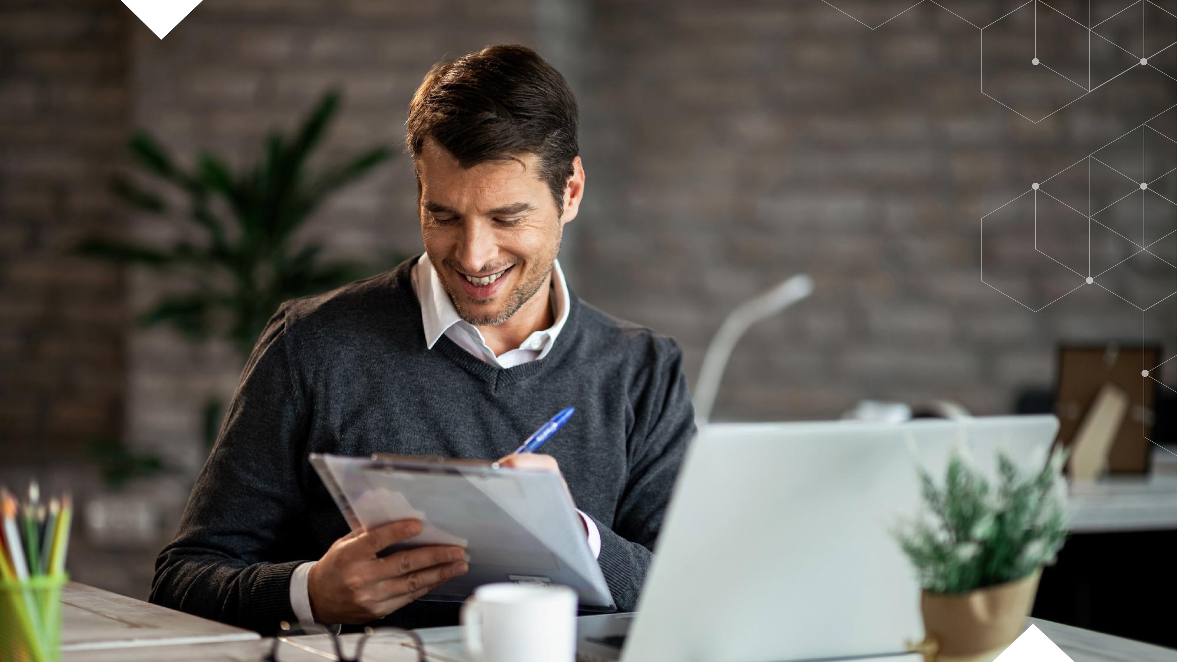 A manager reviewing telecommunications services and looking pleased because Ten4 helped them get a handle on their telecommunications expenses.