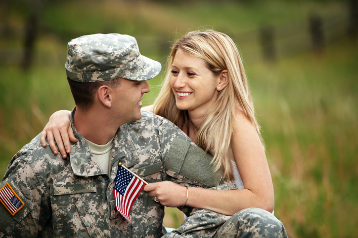 Veteran smiling at his wife. 