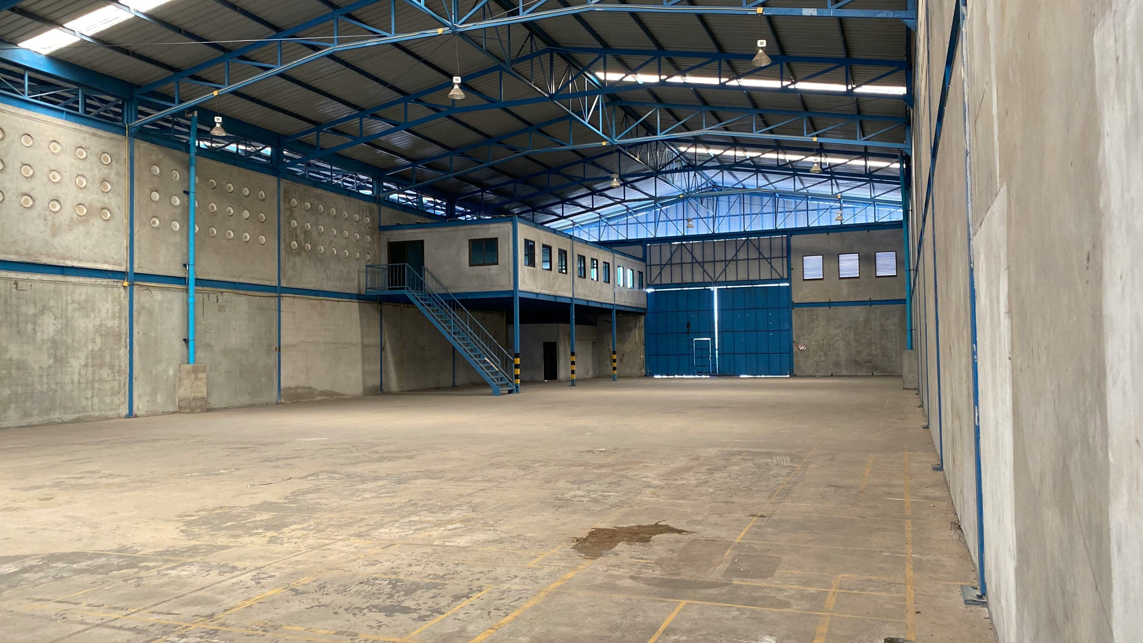 In a bright office space, modern business owners are intently reviewing commercial property documents, discussing aspects of commercial mortgages and financing options for their business premises. The atmosphere reflects a focus on property finance and investment opportunities.