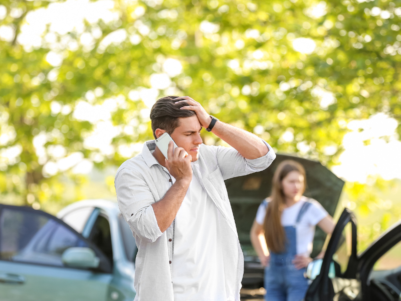 Image of a person calling a lawyer after a car accident.