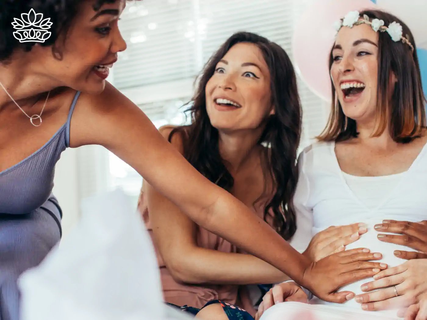 Excited Friends at a Baby Shower Touching the Baby Bump - Baby Shower Gift Boxes Collection with Fabulous Flowers and Gifts, Featuring Baby Shower Gift Ideas, Baby Shower Gift Baskets, and Baby Shower Gifts Including Diaper Bags.