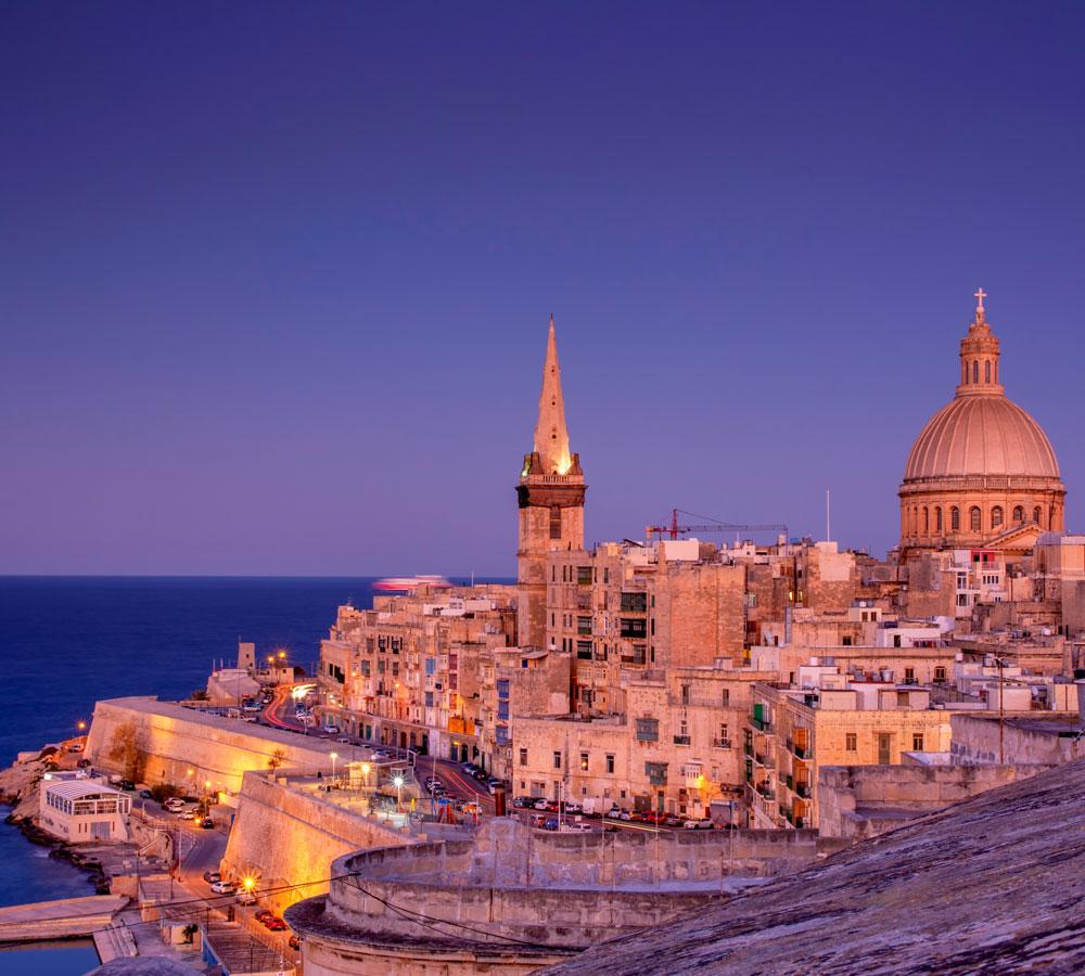 Valletta Malta skyline at dusk representing relocation lifestyle for UK expats moving to Malta from UK.