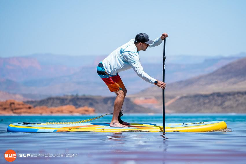 paddling an inflatable stand up paddleboard