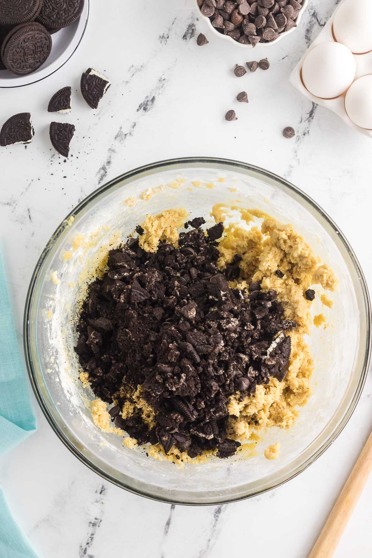 Oreo crumbs in bowl of cookie dough