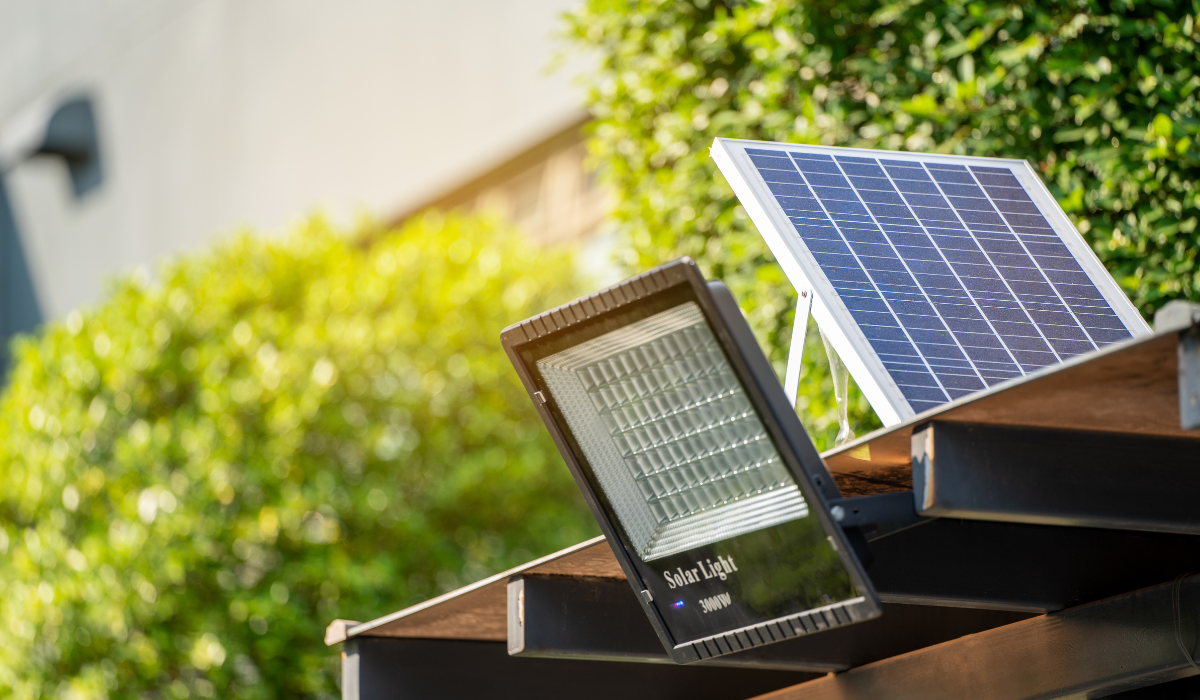 Exterior solar flood lights  - LED flood light with detached solar panel - mounted on shed roof