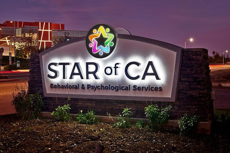 Building Signs – Star of CA monument sign with halo-lit channel letters, dimensional letters and external ground lights in Ventura, CA.