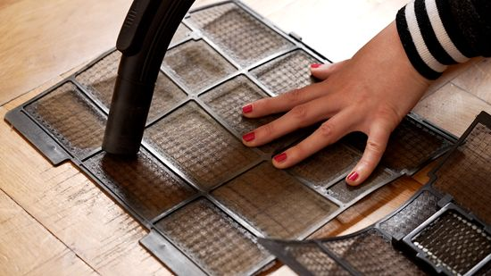 Brush the air conditioning filter with a vacuum cleaner or soft brush
