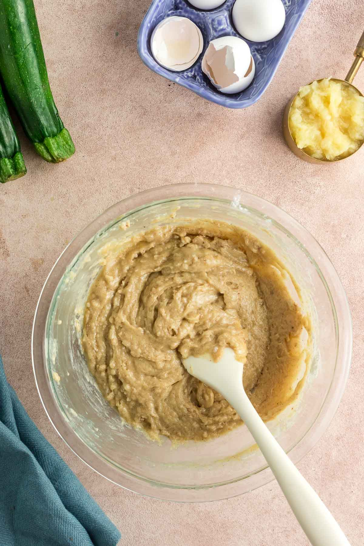 zucchini bread batter in large bowl without zucchini added yet