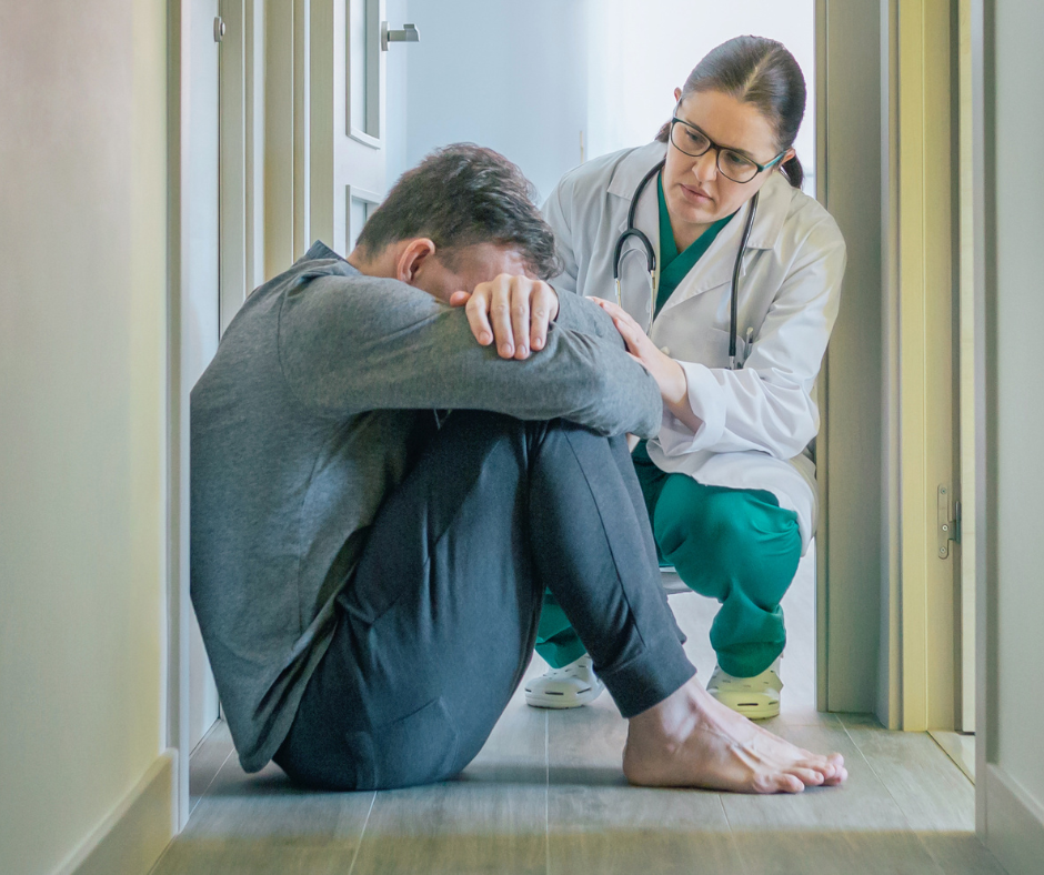 A doctor talking to a patient about mental health issues related to drug and alcohol addiction