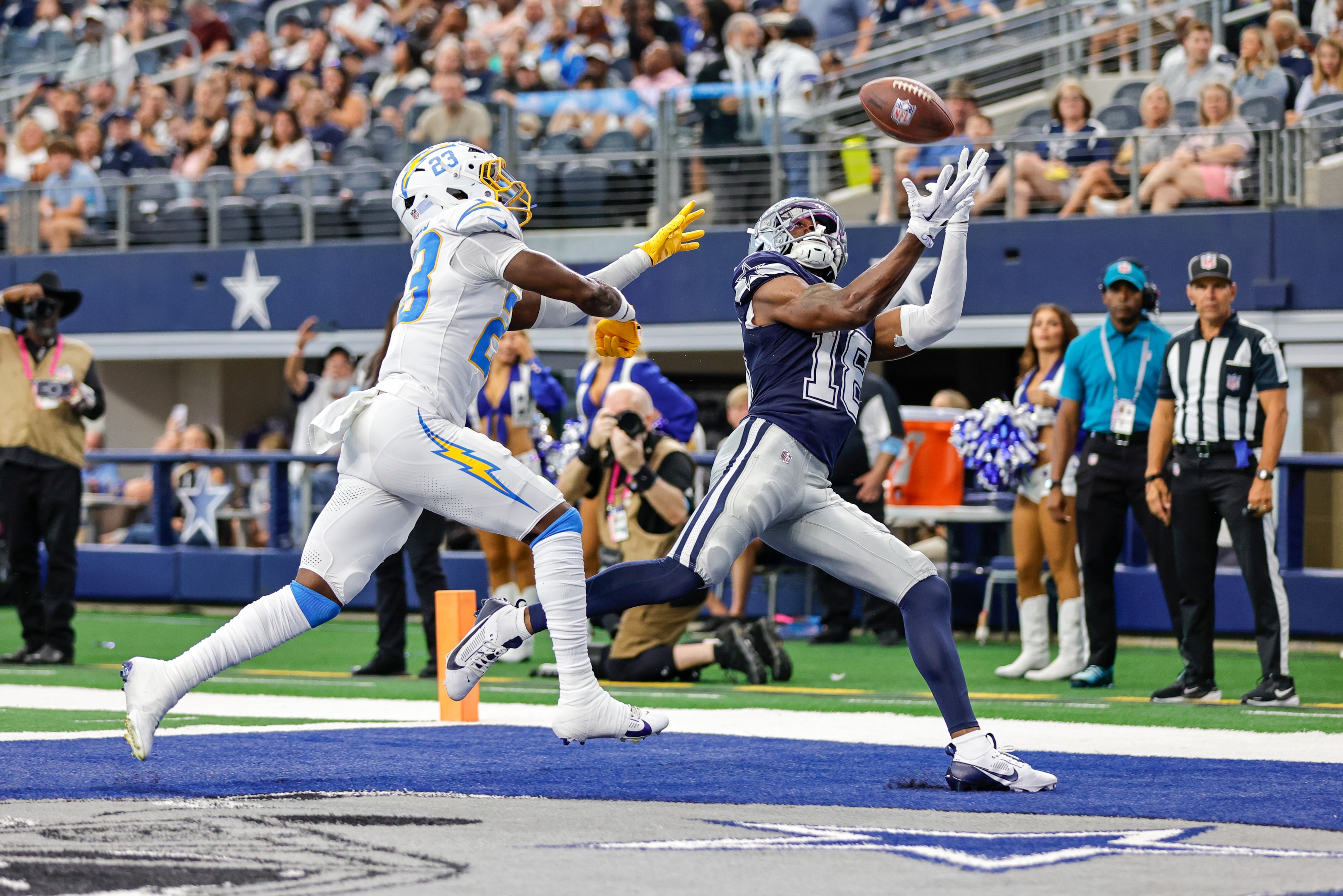 Dallas Cowboys wide receiver Ryan Flournoy catches a touchdown over Los Angeles Chargers cornerback Matt Hankins during a game between the Dallas Cowboys and the Los Angeles Chargers on August 24, 2024 at AT&T Stadium in Arlington, Texas. 