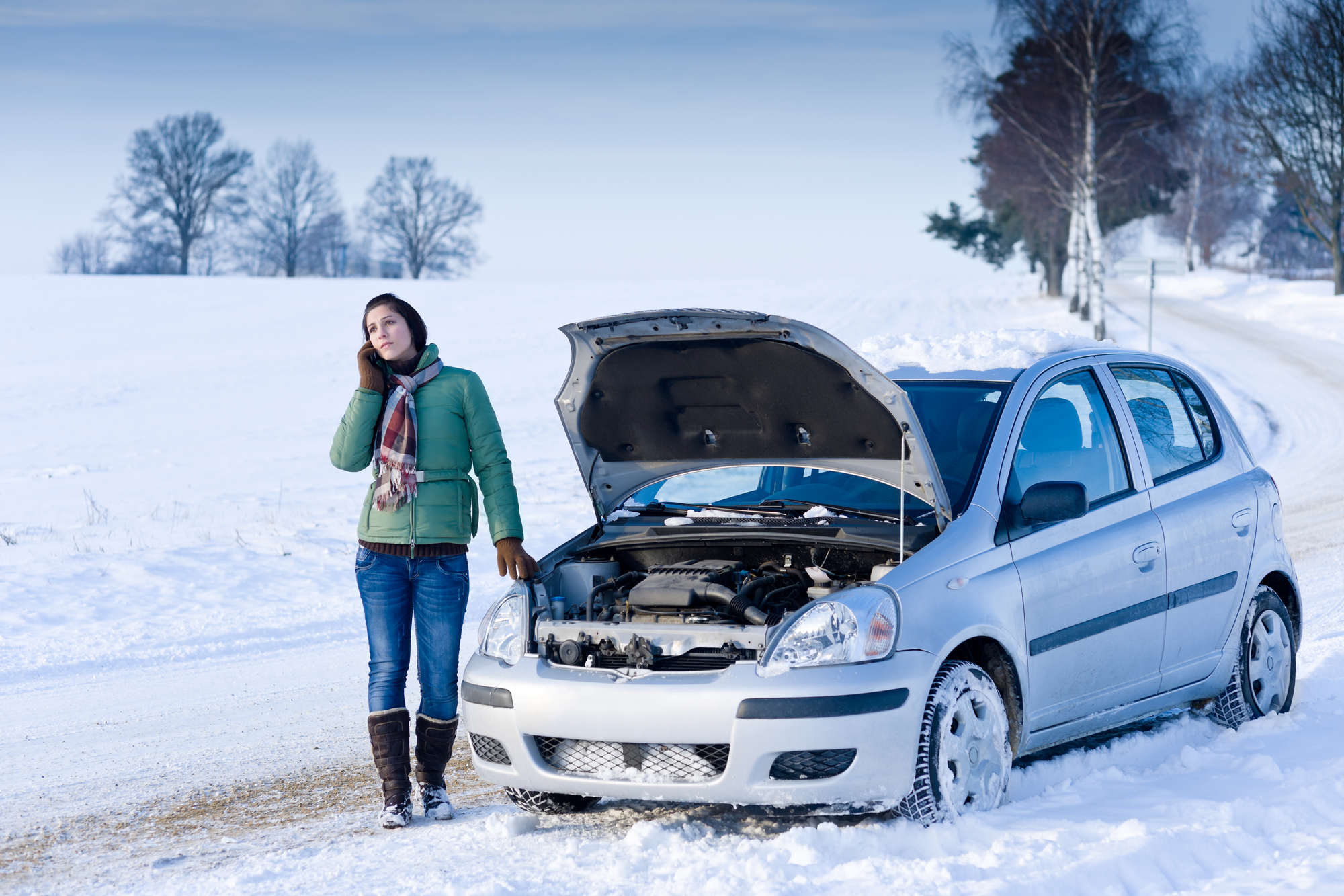 Car break down on the road, woman call assistance, winter outside.