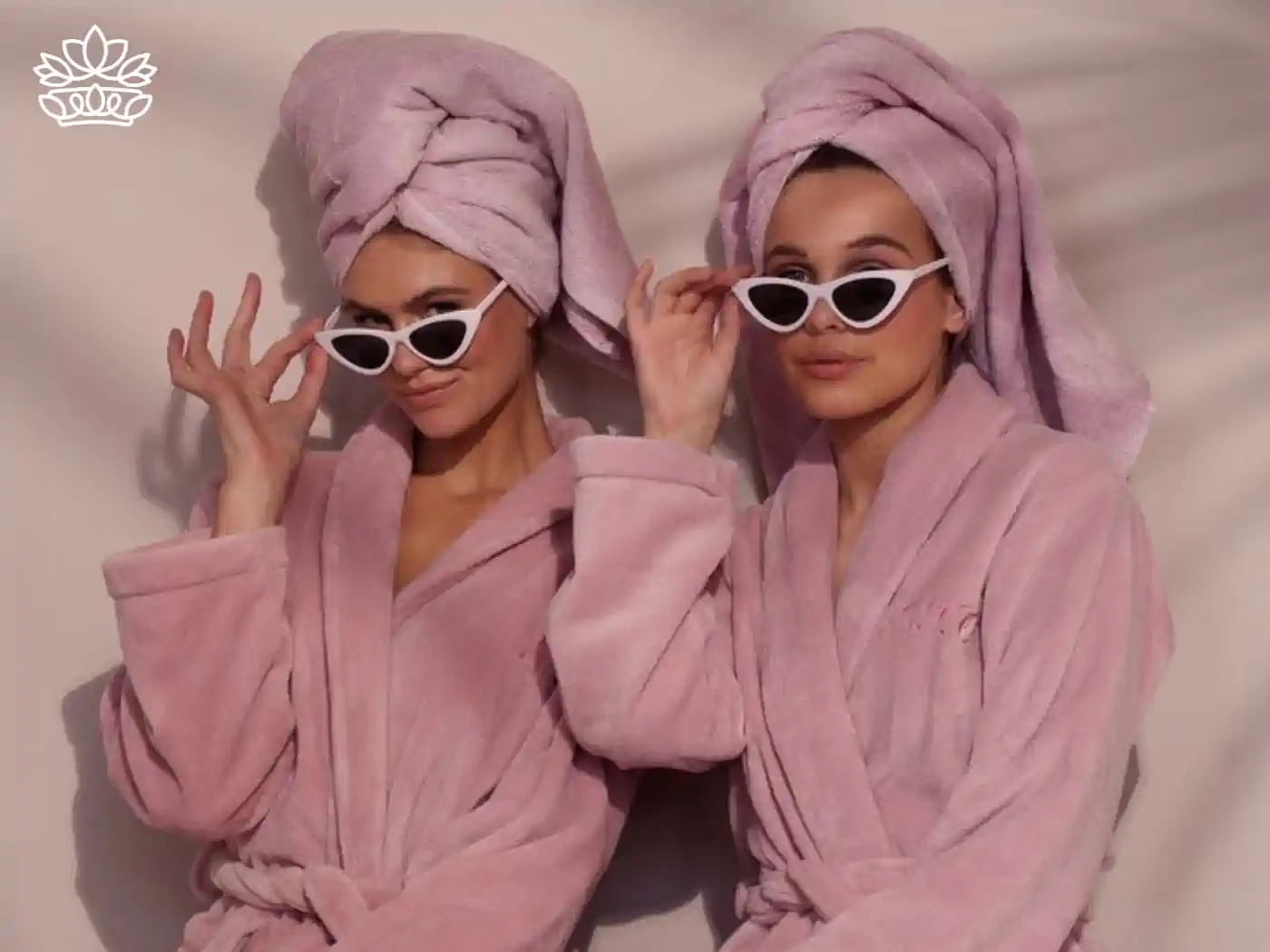 Two sisters in pink gowns and pink towel wraps on their hair, with white sunglasses posing for a picture.Gift Boxes for Sister. Fabulous Flowers and Gifts 