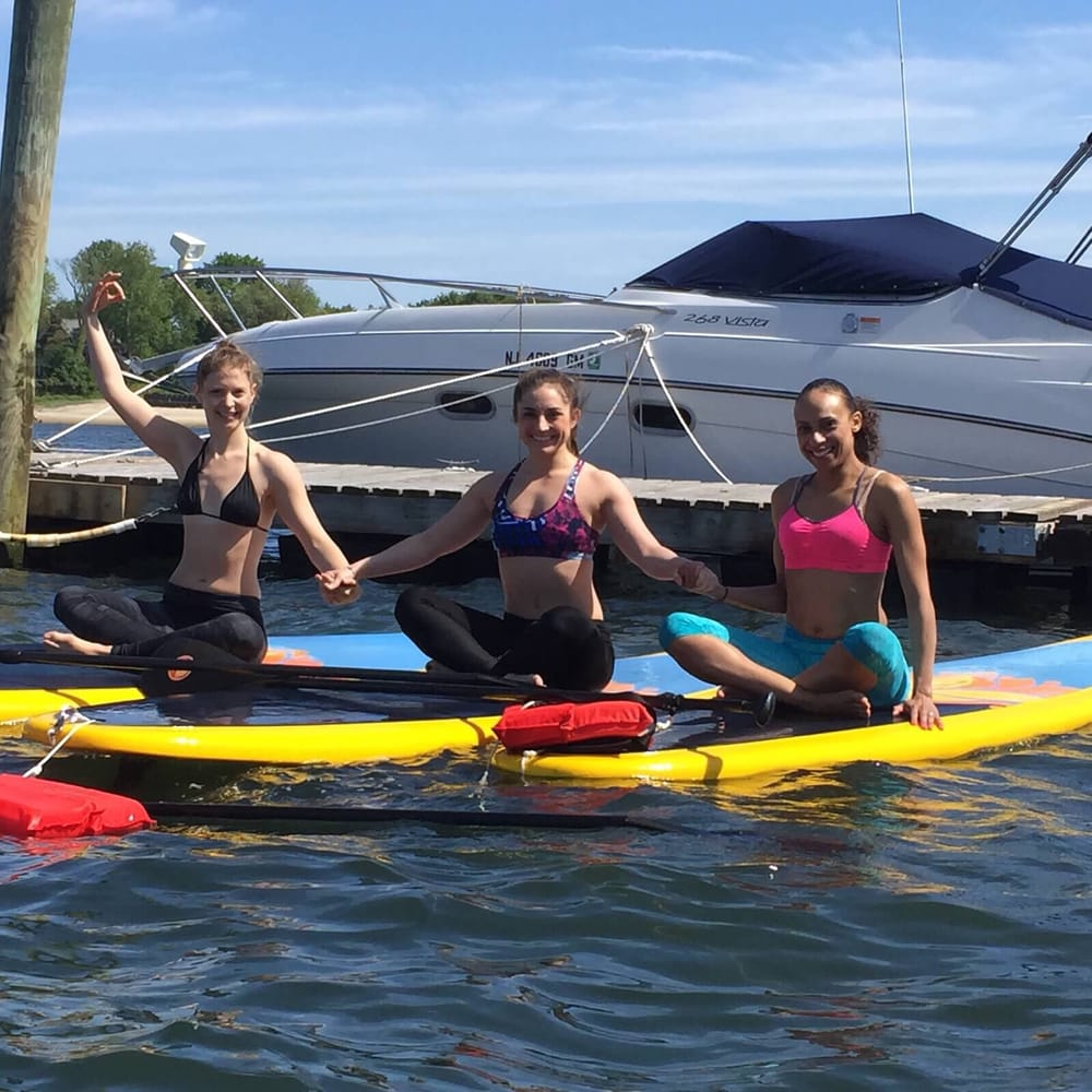 women on paddle boards