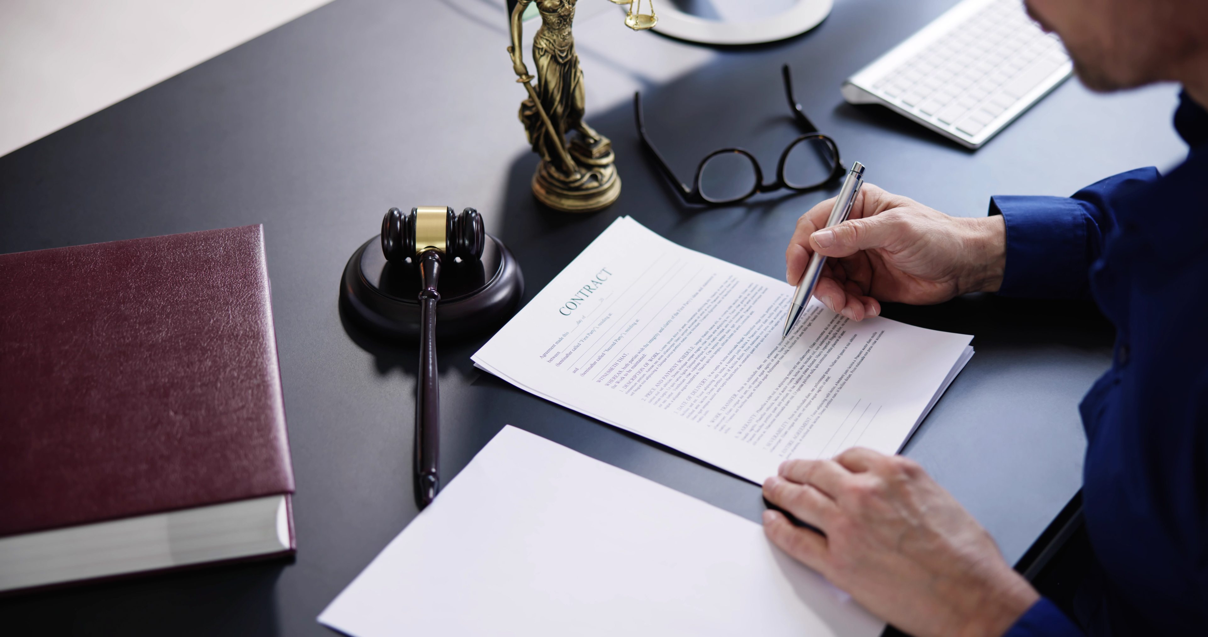 A Michigan gun lawyer prepares legal documents for a civil infraction case involving a minor misdemeanor offense related to guns, showcasing the expertise needed in such extremely difficult legal battles.