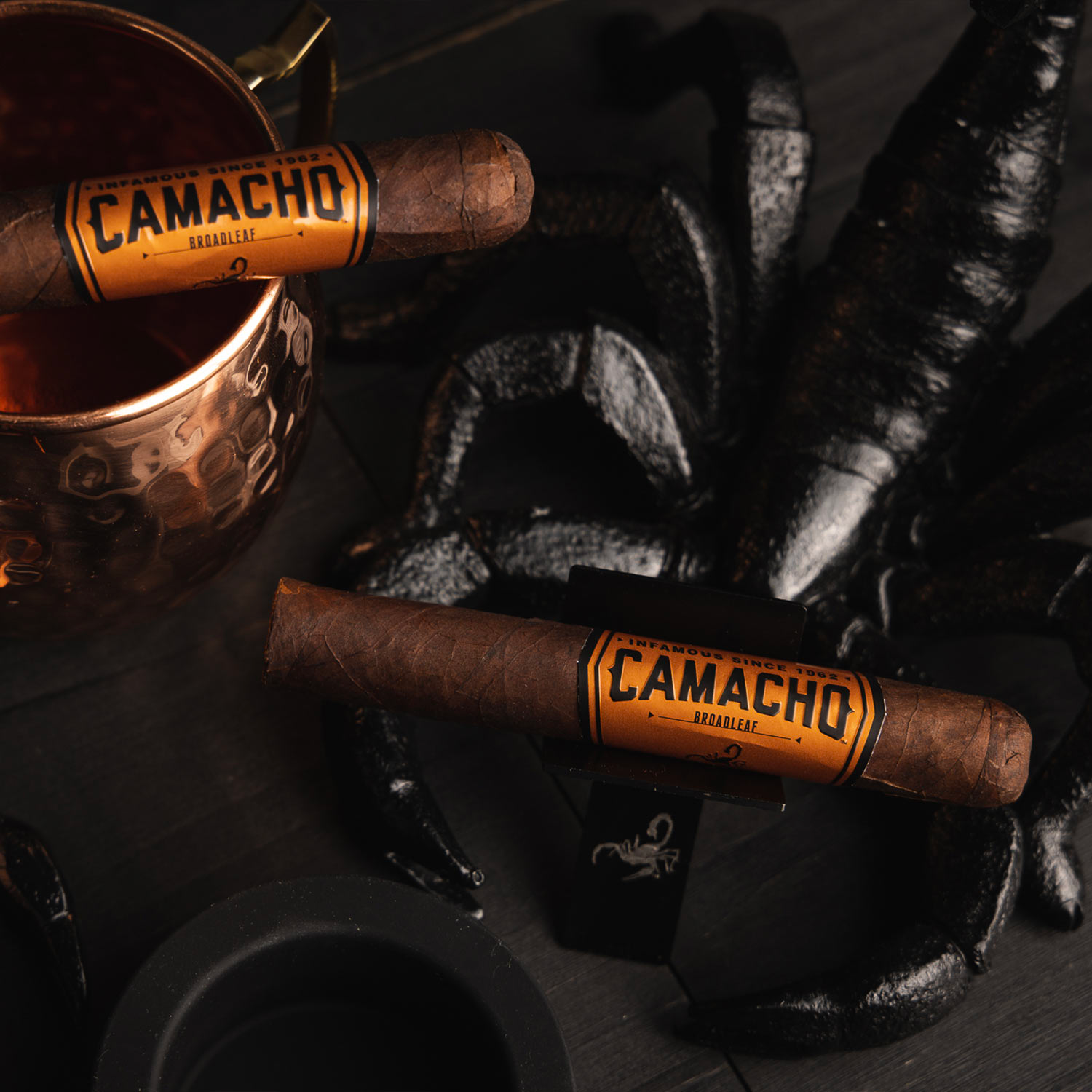 A close-up image of Camacho Broadleaf cigars, showcasing their silky appearance and bold smoke.