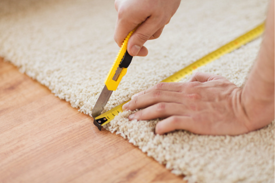 cutting carpet in installation process