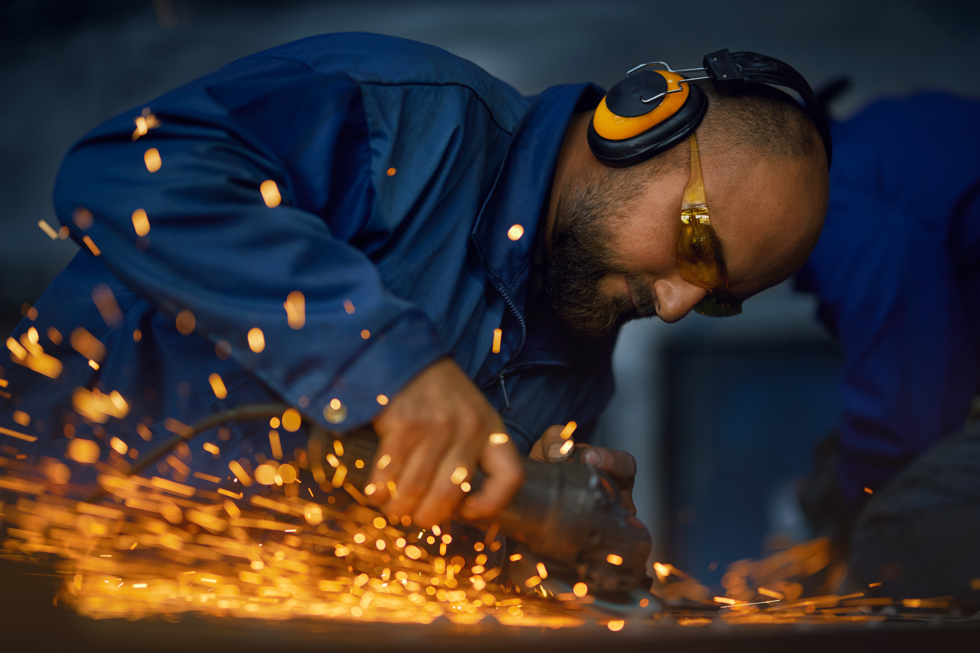 Guy wearing welding glasses - gas welding equipment