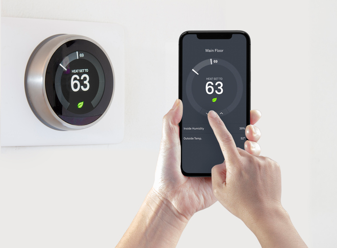 Smart thermostat for an HVAC system controlled by a mobile app via Wi-Fi