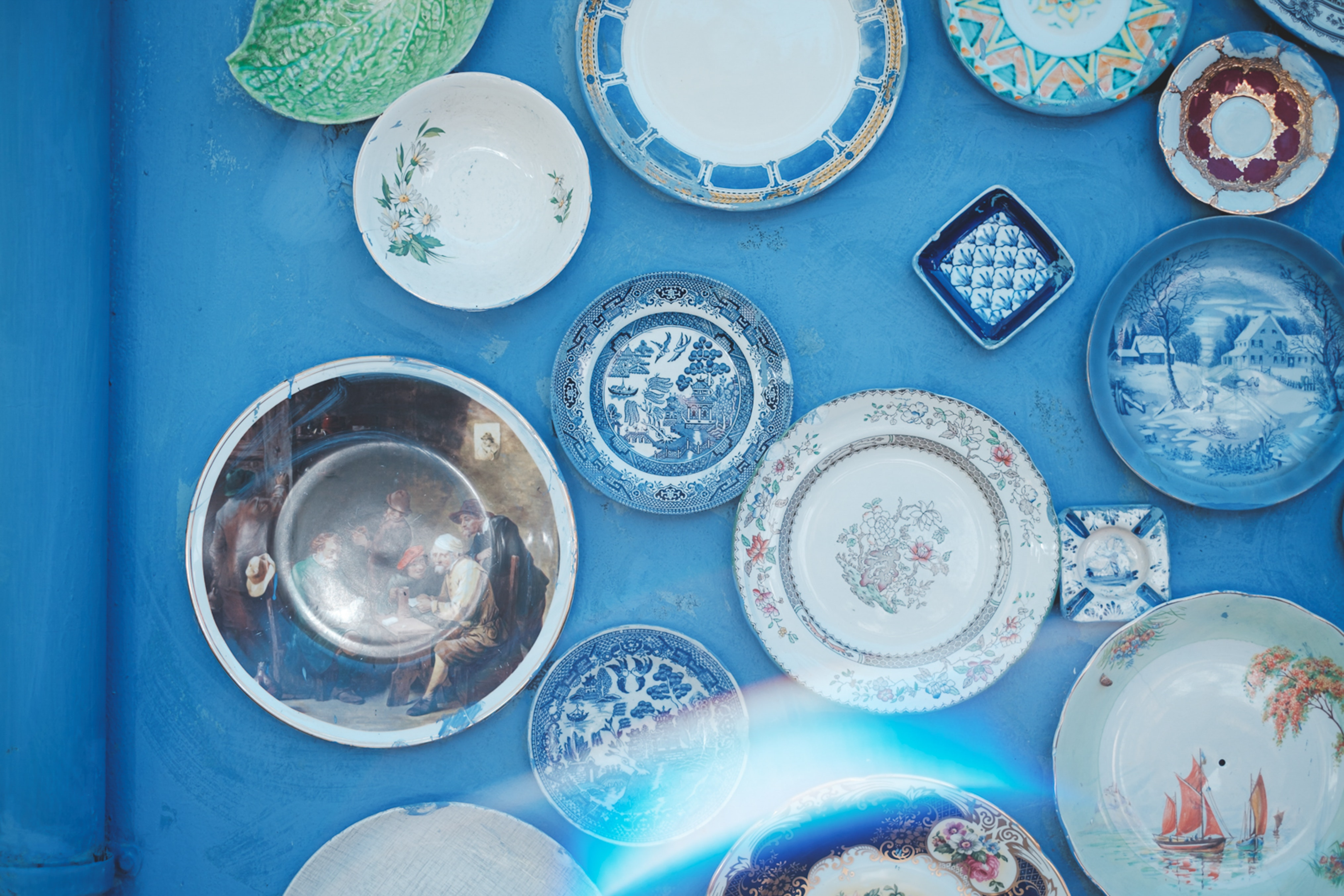 ornamental plates on blue wall