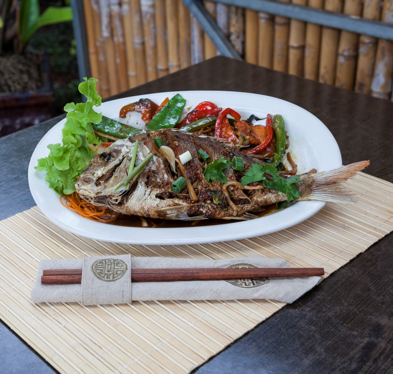 Delicious Thai fish dish served on a plate, showcasing vibrant colours and tempting presentation.
