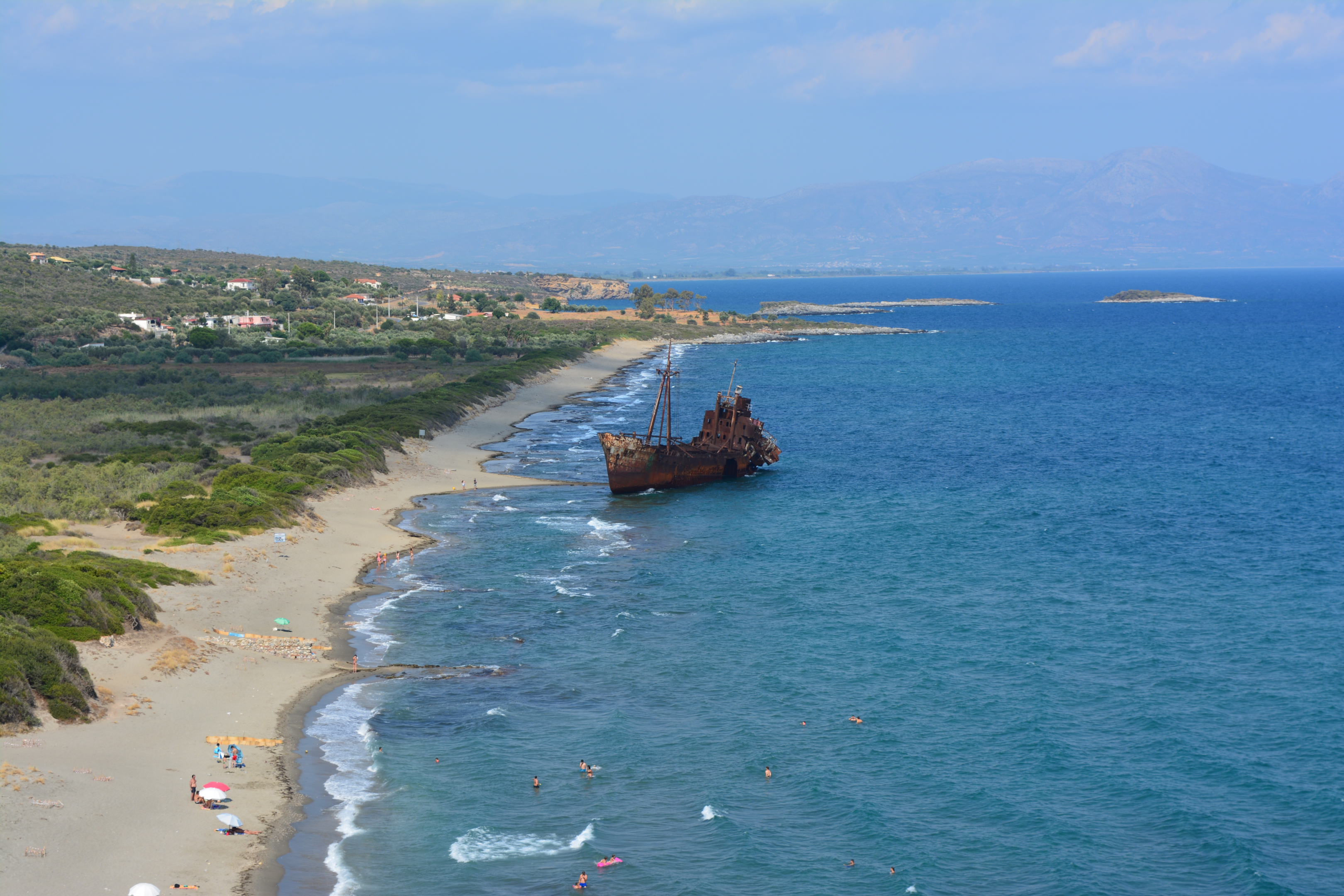 16 Best Beaches in the Peloponnese 17 Phot of Valtaki beach and the half-sunken and decayed shipwreck, Gytheio, Greece
