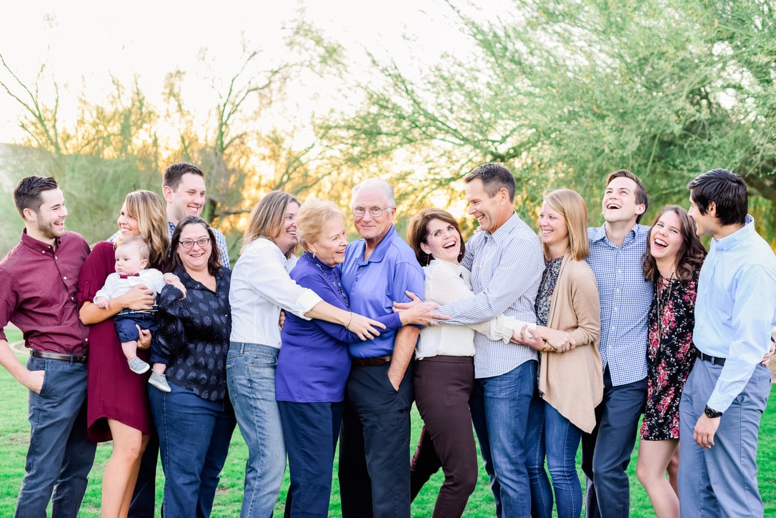 A joyful family capturing precious moments during a photography session in Phoenix.