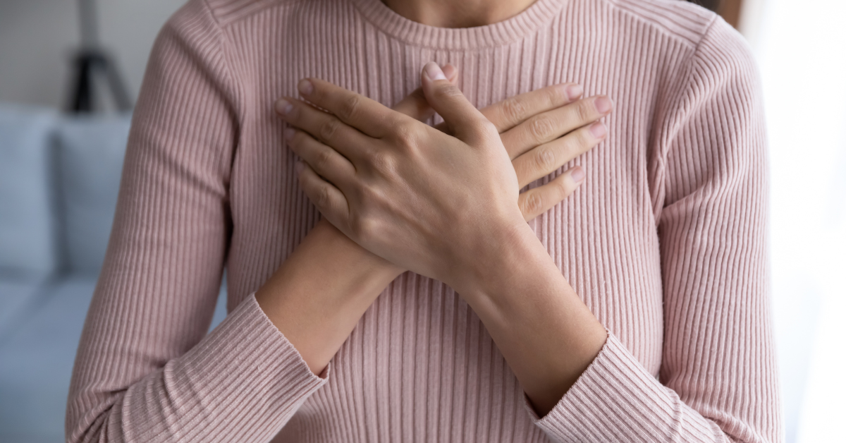 Image of a woman with her hands on her chest, symbolizing a better life from the benefits of zero gravity massage chairs.