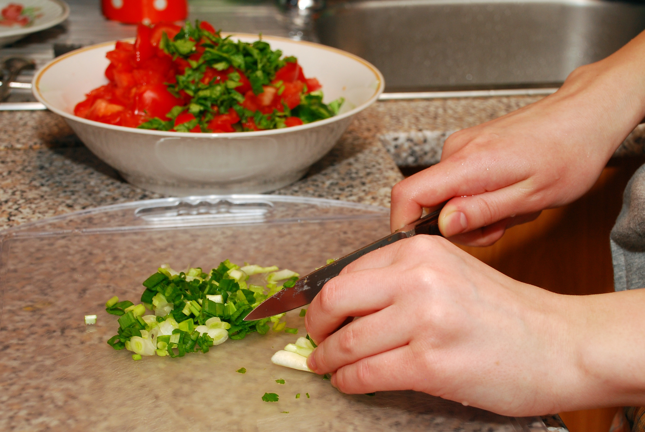 slicing, near the blade, fingers near the blade