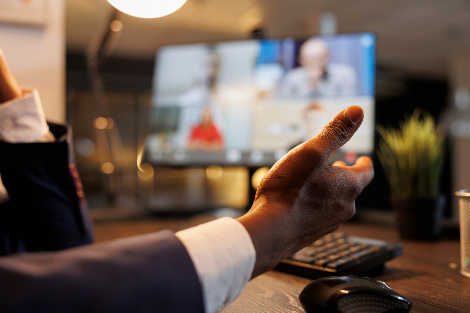 A manager giving online recognition to remote workers.